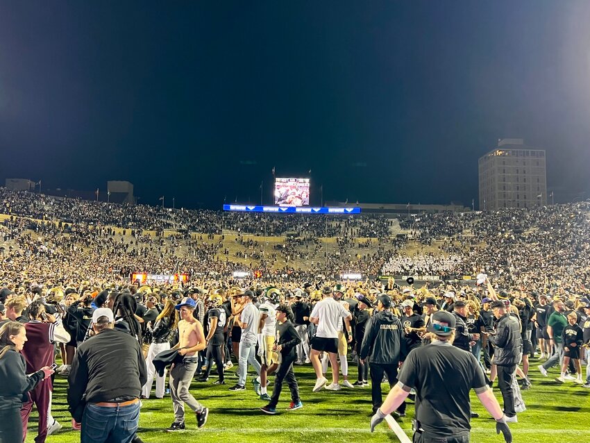 Fans storm the field after Colorado beats Colorado State 45-35 in double overtime Sept. 16 at Folsom Field in Boulder. Fourteen players from Colorado Community Media's various coverage areas suited up for the rivalry game.
